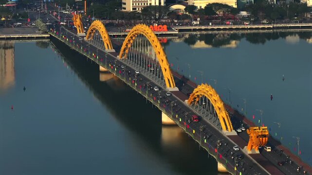 Traffic on a Dragon Bridge in Da Nang, Aerial Morning Shot. Coastal City of Danang in Central Vietnam, South East Asia.