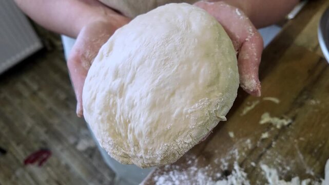 Woman hands kneading bread dough close up homemade baking sourdough preparation artisan bakery cooking process