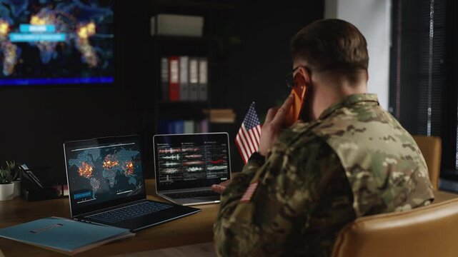 U.S. army general watching international armed conflicts while talking on phone