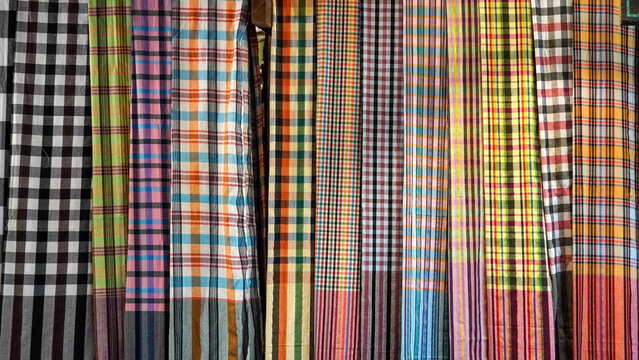 Colorful Thai traditional checkered patterns hanging in a row