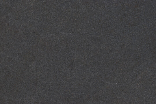 Grunge dust scratch overlay texture on black background for design