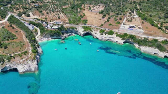 Spectacular drone view of Xigia Sulfur Beach in Zakynthos. Famous for its healing sulfur springs, crystal turquoise water, and steep limestone cliffs in a scenic Greek island bay.