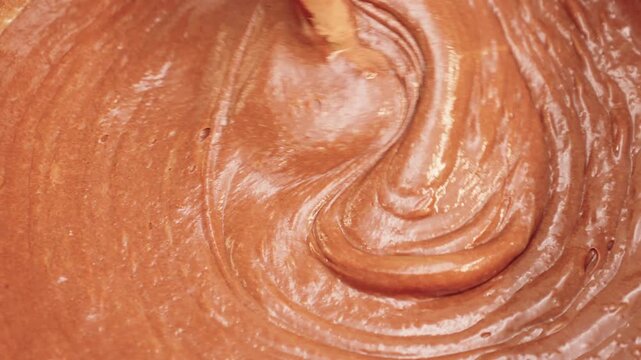 Liquid Chocolate Batter Swirling During Mixing, Glossy Brownie Texture And Dessert Preparation Process