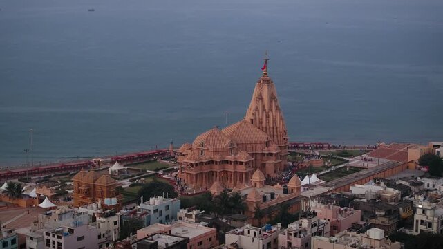 Aerial view of Somnath Temple in Gujarat, India, showcasing the grand coastal shrine dedicated to Lord Shiva. The image highlights the temple&rsquo;s majestic architecture and the Arabian Sea.