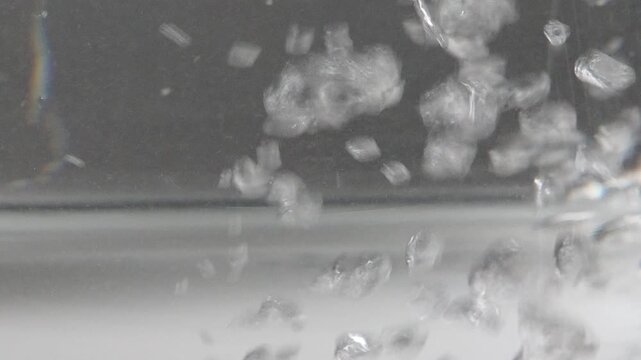 4K air bubbles forming and rising in clear water begins to boil, Physical transition of heating liquid.