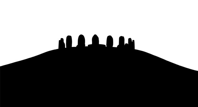 Silhouette of standing stones on hill.