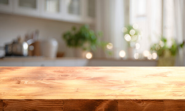 A cozy kitchen flooded with morning light and a natural wood countertop in the foreground