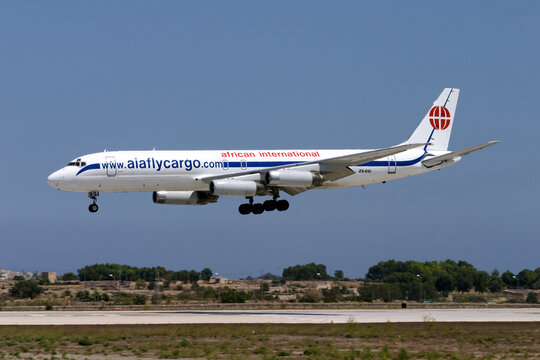 Luqa, Malta - August 25, 2007: African International Airways McDonnell Douglas DC-8-62H(F) (REG: ZS-OSI) landing runway 32 in the midday scorching heat.