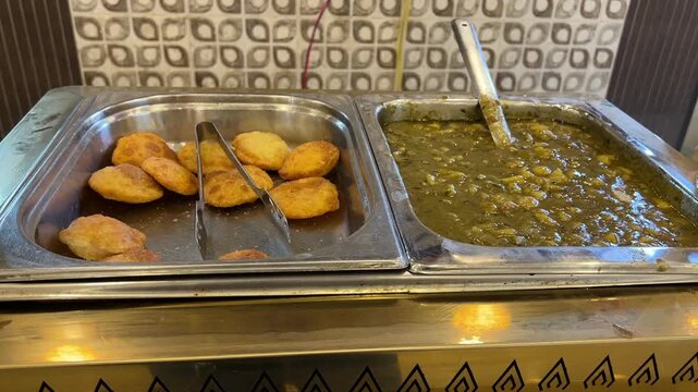 Club kachori with alu sabji served at Sharma Snacks in Kolkata; professional street food photography of traditional mini kachori, spicy potato sabzi, and popular North Indian breakfast in India.
