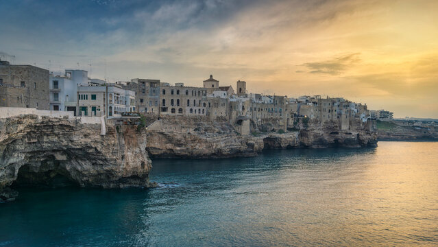 Sunset over Polignano a Mare Village on Cliffs, Puglia, Italy