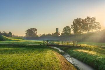 Naklejka premium Sunrise over Lucca Ancient Walls and Footbridge, Tuscany