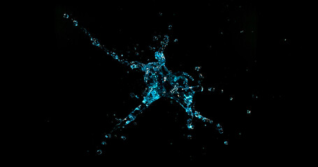 Dynamic water splash explosion isolated on black background with realistic liquid droplets for VFX overlay and cinematic visual effects © Jag_cz