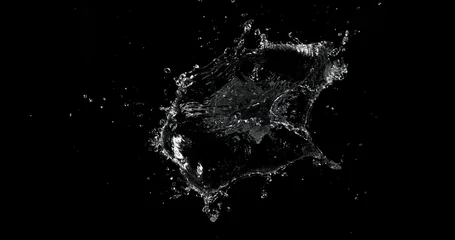 Dynamic water splash explosion isolated on black background with realistic liquid droplets for VFX overlay and cinematic visual effects © Jag_cz