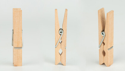 Naklejka premium Clothespins in different positions isolated on a light background