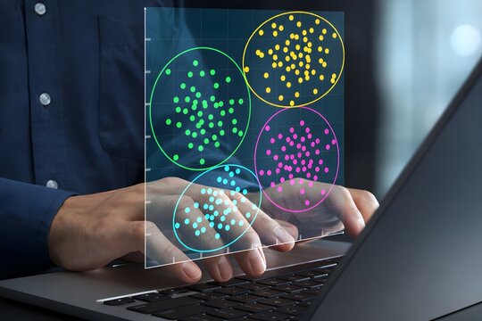 Data clustering chart and cluster analysis. Machine learning and data segmentation. Data scientist using laptop computer to analyze big data.