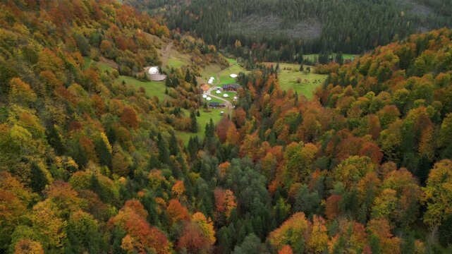 Modern off-grid house in mountains with solar panels and satellite internet