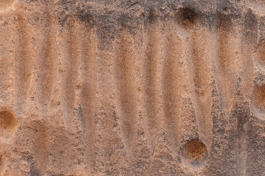 Carved sandstone texture background with abstract erosion pattern and copy space