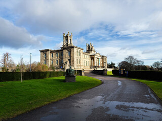 Obraz premium Historic neoclassical Modern Two museum building with sculpture and grounds in Edinburgh, Scotland, UK set against a dramatic cloudy sky