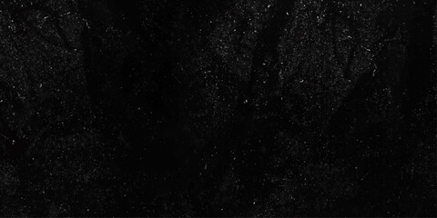 Obraz premium Black crumpled paper texture background. Natural organic shapes and design. The glossy black background is blurred 