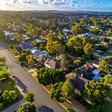 Aerial view of suburban neighborhood at sunset