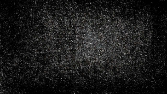 White particles on black background with textured grainy noise effect overlay