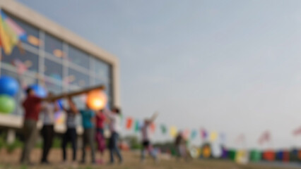 Obraz premium Group of people enjoying an outdoor event near modern architecture