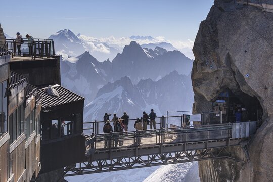 Tourists on viewing platform in front of mountains, mountain station, Aiguille du Midi, Mont Blanc massif, Chamonix, French Alps, France