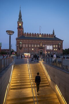 Illuminated staircase, metro station, town hall in national romantic style by Martin Nyrop, Town Hall Square, Rathausplatz or R&aring;dhuspladsen in the evening, Copenhagen, Denmark