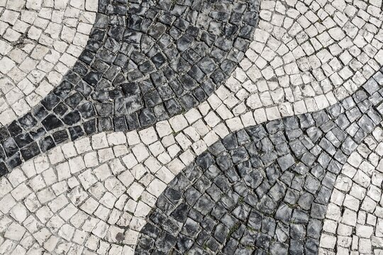 Wavy pattern in pavement, black and white, cobblestones, Rossio, Lisbon, Portugal