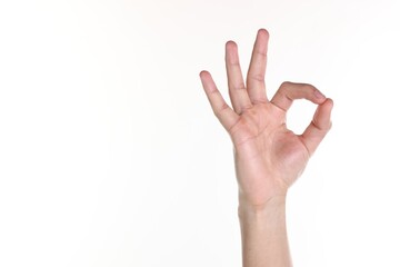 Naklejka premium Man showing ok gesture on white background, closeup. Space for text