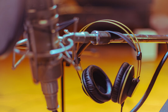 Vintage microphone and headphones in the recording studio