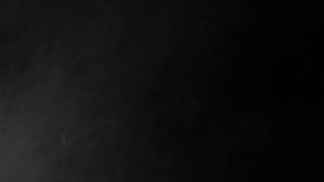 Minimalist Black Background with Subtle Digital Noise Texture.