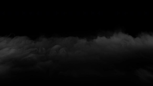 Realistic ground fog or smoke effect moving slowly across a black background.