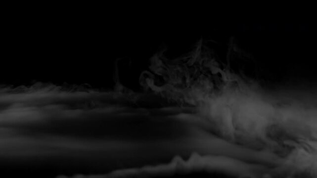 Realistic white smoke fog and mist drifting across a black background.
