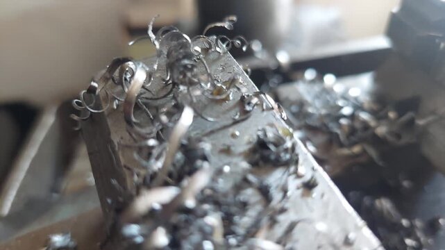 Close up of metal shavings on a mechanical vice in workshop
