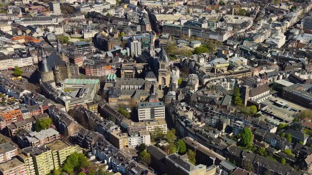 A panorama aerial view above the old town of the city Aachen on a sunny spring noon in Germany.