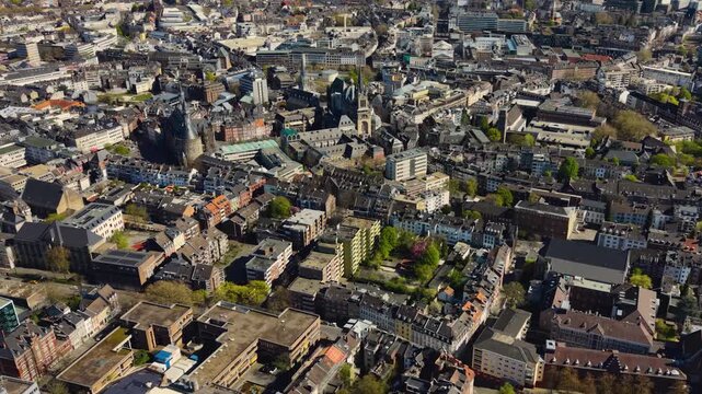 A panorama aerial view above the old town of the city Aachen on a sunny spring noon in Germany.