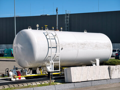 Butane storage tank with pressure control valve at an industrial gas station