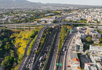 Fototapeta premium Modern complex freeway overpass system connecting multiple lanes of vehicles through a vibrant urban landscape