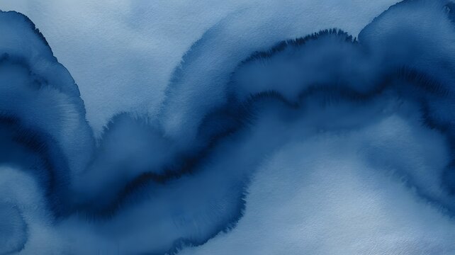 Abstract watercolor wash in shades of blue flowing ink texture on white background
