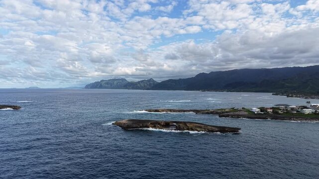 Aerial view of Laie Point and the Koolau mountain range in the background in northeastern Oahu in Hawaii. 