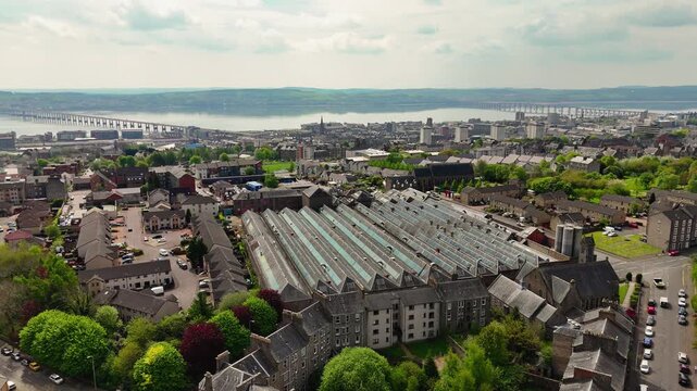 Aerial Drone Flight Toward River Tay Bridges and Dundee Cityscape Scotland Urban View