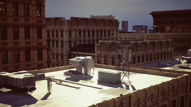 Sunlit urban rooftop skyline at dusk, cinematic warm light casting long shadows across HVAC units, brick parapets, and water tower vintage grain and hazy