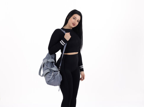 Woman with backpack - standing and ready for travel or study in professional stu