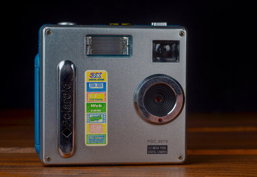 PERPIGNAN, FRANCE - MAY 11, 2026: A Polaroid PDC 3070 compact digital camera on a wooden surface. Vintage point and shoot camera from the early 2000s is a classic example of retro digital technology