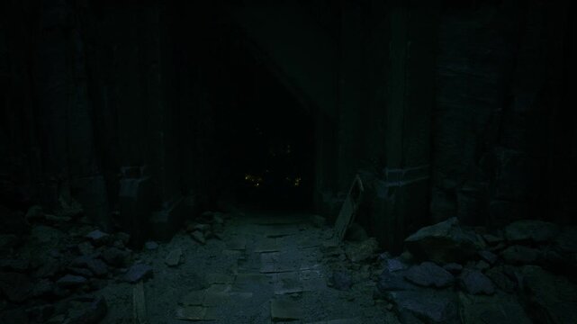 Moody stone entrance into vaulted cavern, towering columns and deep shadows create cathedral like silence, scattered rocks and textured floor lead eye into