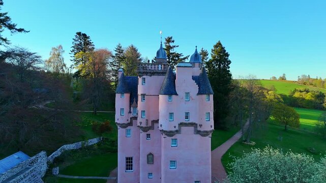 Cinematic Drone Shot of Craigievar Castle: Aerial View of the Pink Fairy Tale Fortress in Scotland