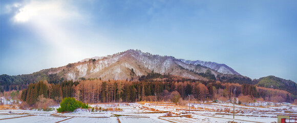 Panoramic view of the mountain and woods in snow with bright sky, Ogawara, Japan