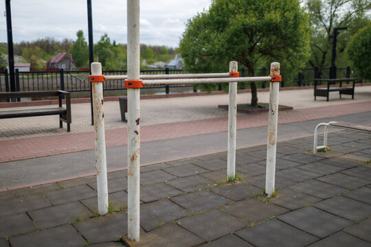 Metal parallel bars for dips located at a public riverside fitness area