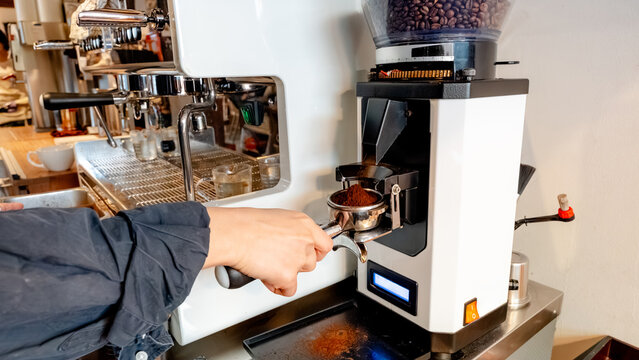 Barista preparing espresso in coffee shop